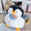 Jooki Cánh Cụt pose dáng đáng yêu bên sách decor, thích hợp trang trí phòng ngủ.