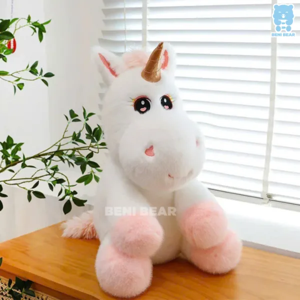 Gấu bông kỳ lân chibi mắt to tròn, chân hồng pastel ngồi cạnh cửa sổ, lông trắng mịn như mây