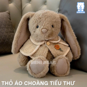 Gấu bông thỏ mặc áo choàng tiểu thư ngồi với ánh nhìn dịu dàng